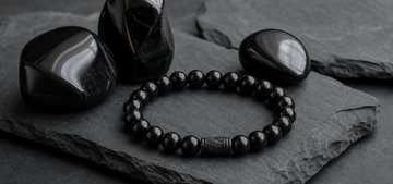 Black obsidian stones on slate